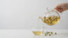 Golden chamomile tea poured into a glass cup
